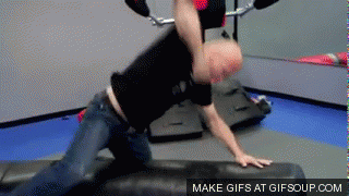 Angry-Guy-Lets-Off-Some-Steam-At-The-Gym-Beating-Up-His-Equipment.gif
